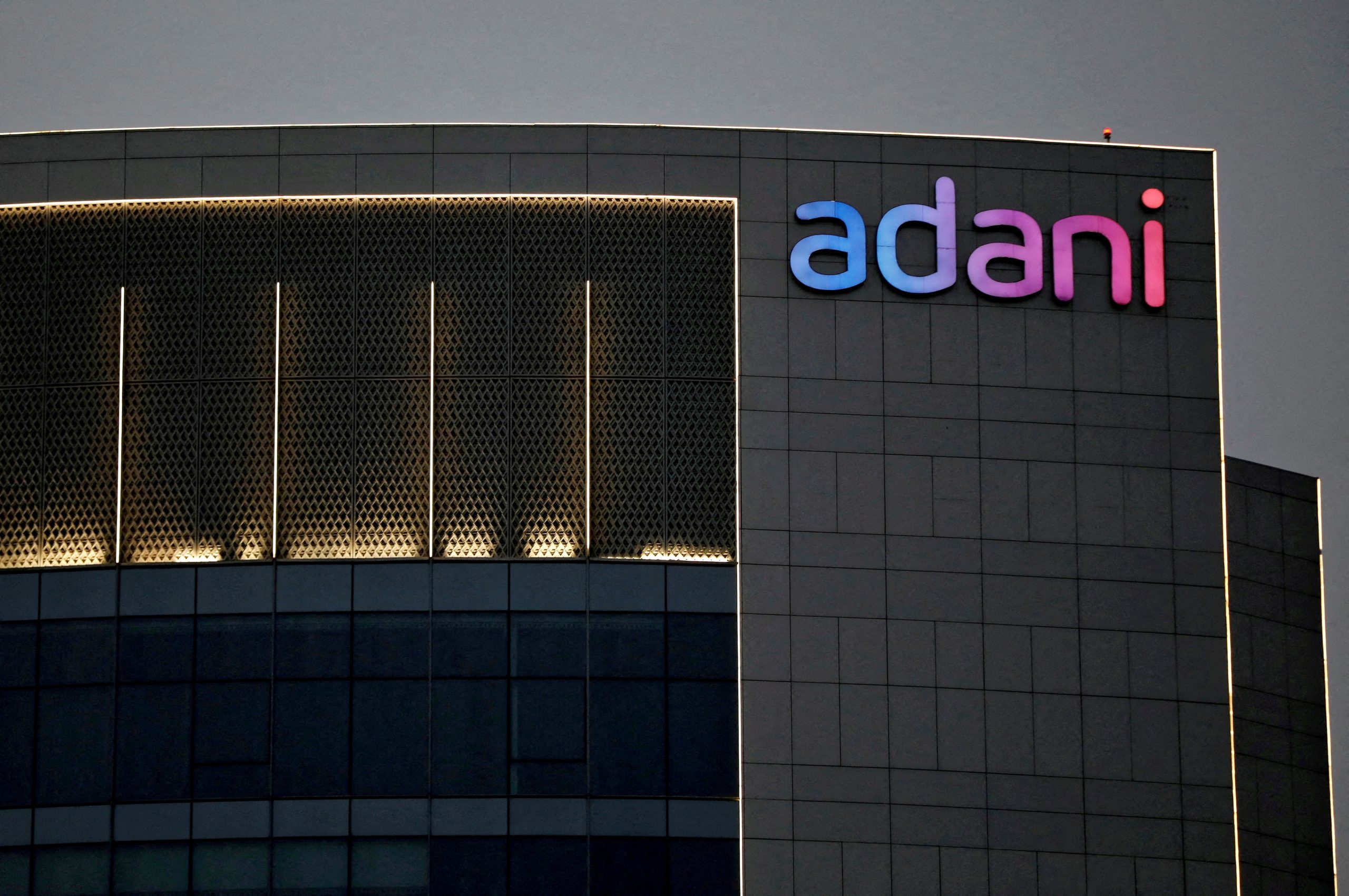 Adani Group Stocks Surge As Markets Hit Record High